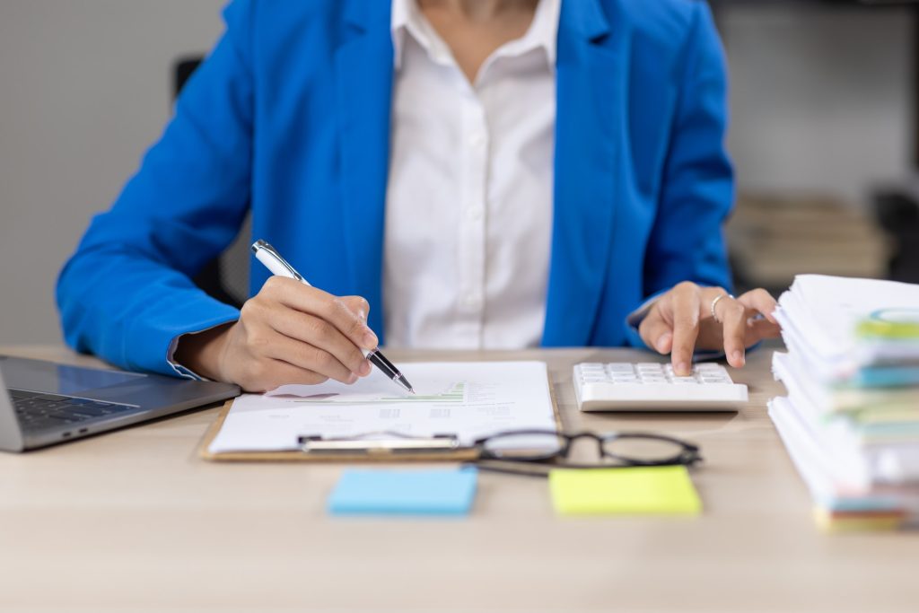 Audit concept,Administrator business asian woman financial inspector and secretary making report cal