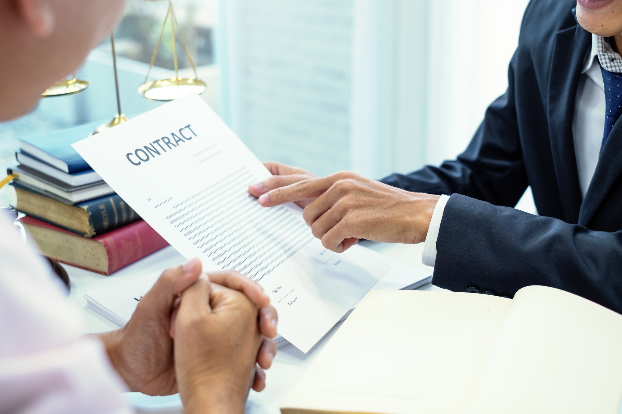 Businessman and lawyer talked about the contract. Legal concept and contract.